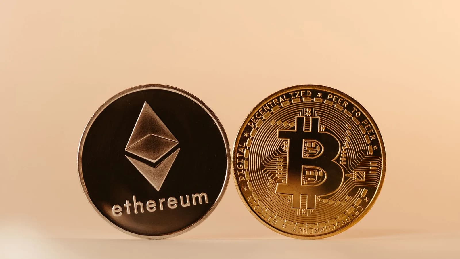 Close-up of Ethereum and Bitcoin coins representing modern digital currency and blockchain technology.