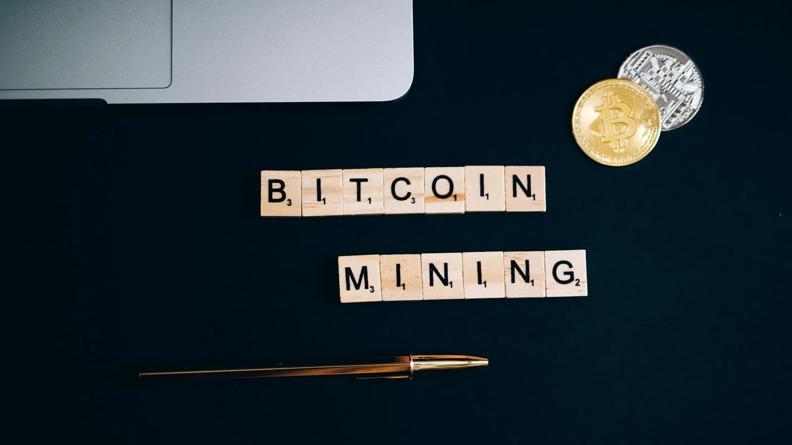 Bitcoin mining concept arranged on a black surface