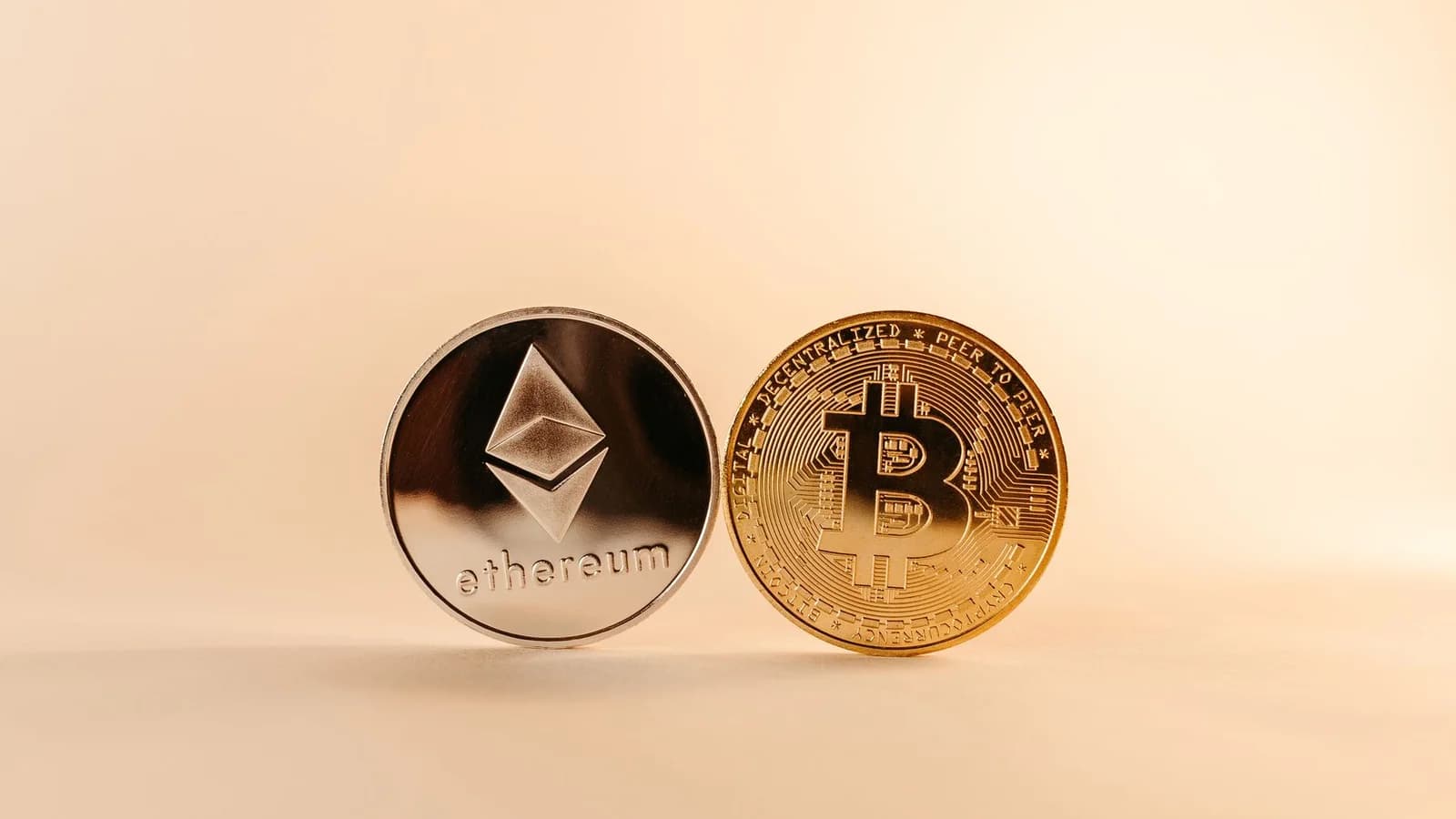 Close-up of Bitcoin and Ethereum coins symbolizing digital currency and blockchain technology.