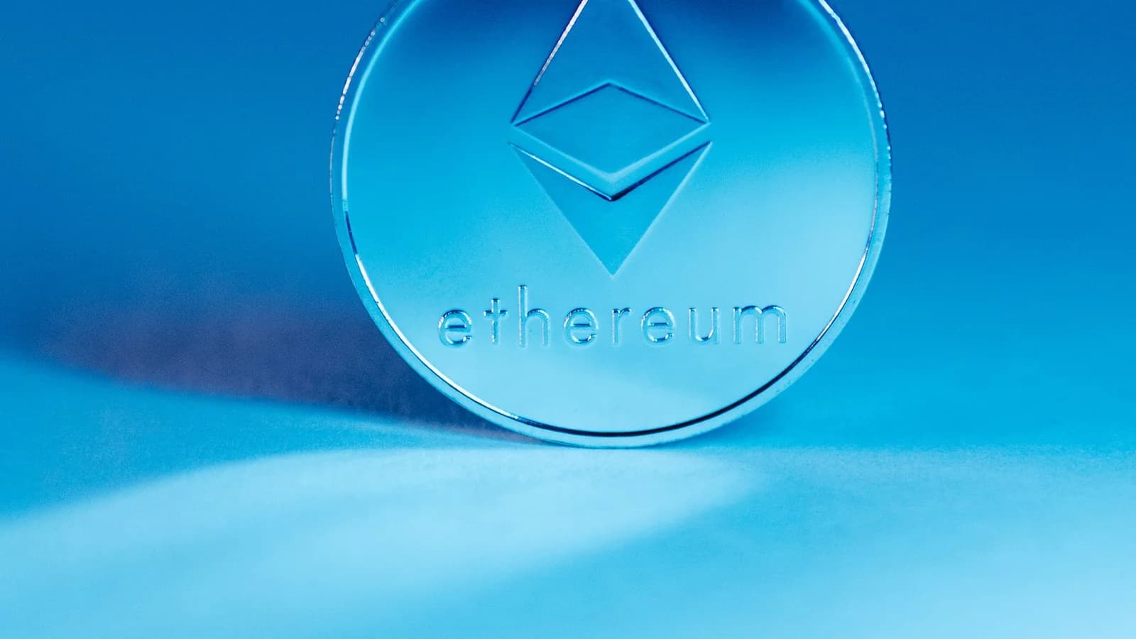 Ethereum coin against a blue background