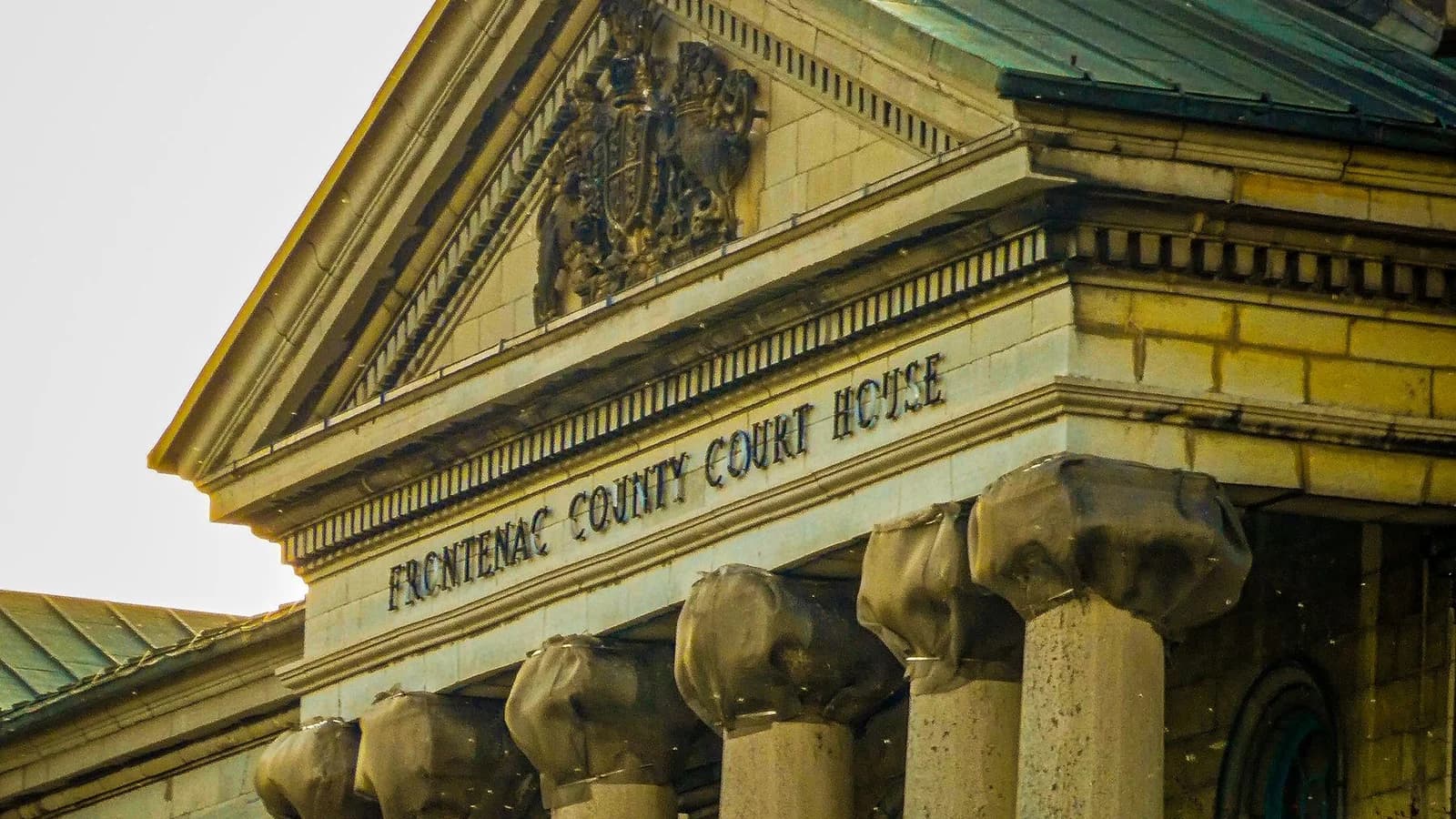 Classic façade of Frontenac County Court House, showcasing neoclassical architecture in Kingston, Ontario.