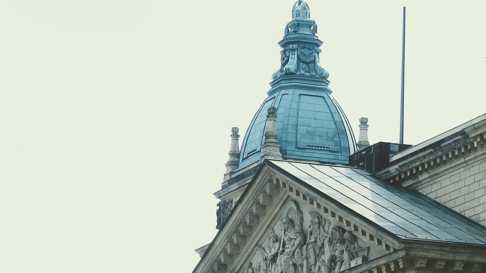 Exterior of a historic German courthouse showcasing classical architecture with ornate columns.
